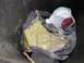 2004 Ford F-350 - A trash can contains towels and a green substance, with a plastic bag partially visible.