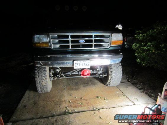 Front view of a 1992 Ford Bronco's steering and axle components, with a Virginia license plate XNX-9685