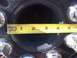 1997 Dodge 3500 - A measuring tape is placed over a vehicle's wheel hub, showing its diameter.
