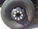 1997 Dodge 3500 - Close-up of a truck's wheel and tire, showing the lug nuts and tire tread details.