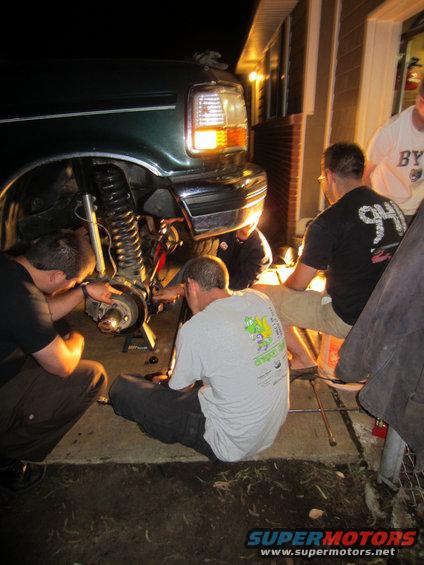 1992 Ford Bronco front suspension work, people gathered around