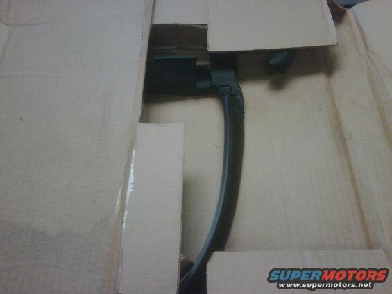 black car door handle inside cardboard box