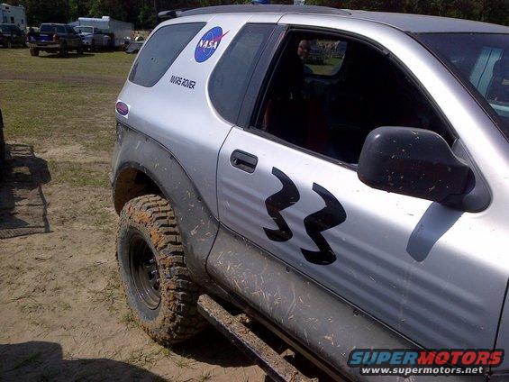 Silver SUV with NASA and number 33 decals, 3/4 front view