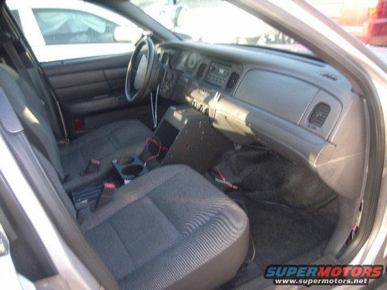 2005 Ford Crown Victoria interior, showing front seats, dashboard, and center console equipment