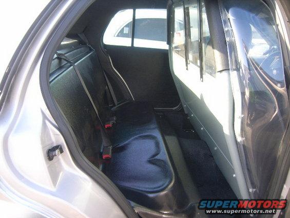 Interior rear seat and partition of a police car