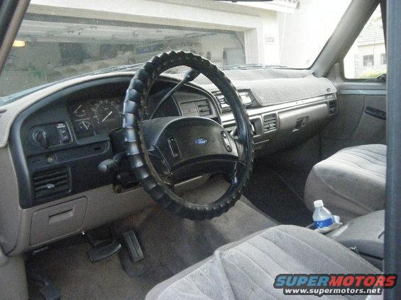 1993 Ford Bronco interior showing dashboard, steering wheel, and seats