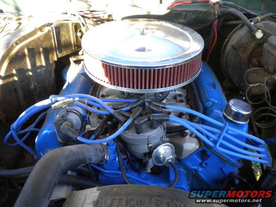 1979 Ford Bronco engine bay with blue valve covers and a chrome air cleaner
