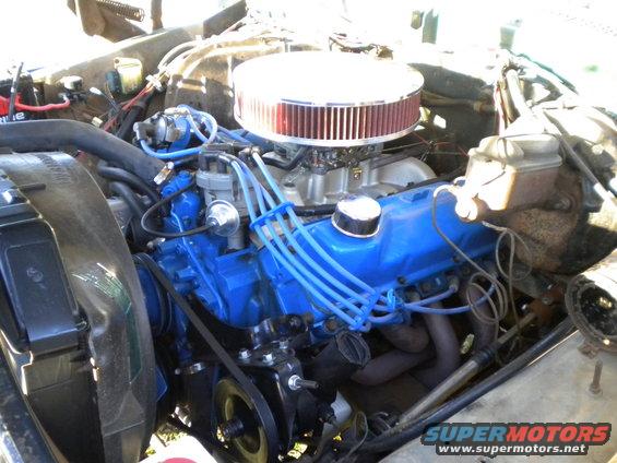Engine bay with blue valve covers, chrome air cleaner, and blue spark plug wires