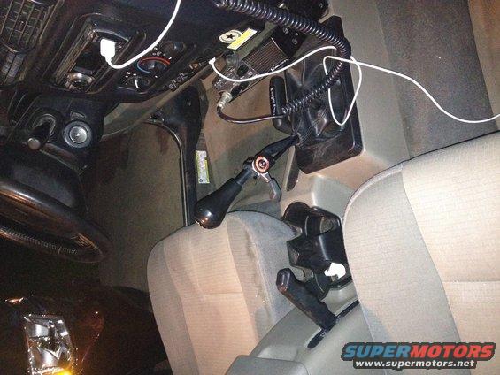 2005 Jeep Wrangler interior showing hand throttle, CB radio, and seats