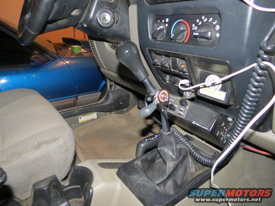 Interior view of 2005 Jeep Wrangler with hand throttle and CB radio