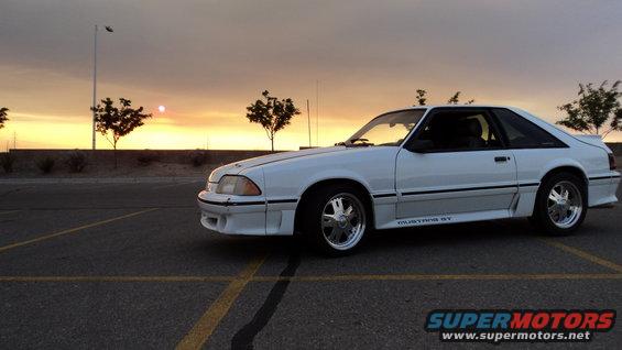 White 1989 Ford Mustang GT parked at sunset