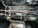 1989 Ford Probe - Engine compartment detail with fuel lines and starter motor visible.