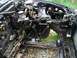 1989 Ford Probe - The engine bay of a car is shown with many components removed, revealing the chassis and brake system.