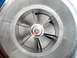1989 Ford Probe - Close-up view of a turbocharger compressor wheel, showing the finely machined blades and a small red mark on the central nut.