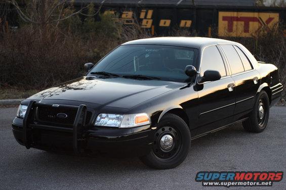 Black 2004 Ford Crown Victoria with push bar
