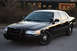 2004 Ford Crown Victoria - This black 2004 Ford Crown Victoria features a distinctive push bar on its front grille.