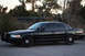 2004 Ford Crown Victoria - A black 2004 Ford Crown Victoria sedan is parked outdoors with a push bar on the front.