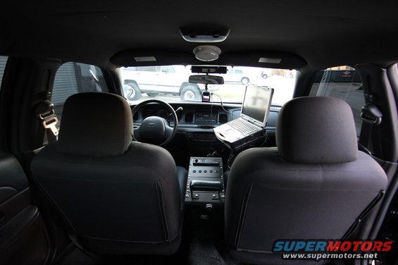2004 Ford Crown Victoria interior with laptop on console
