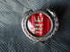1973 Ford Ranchero - This emblem features a red background with three silver lions and a crown, set within a laurel wreath.