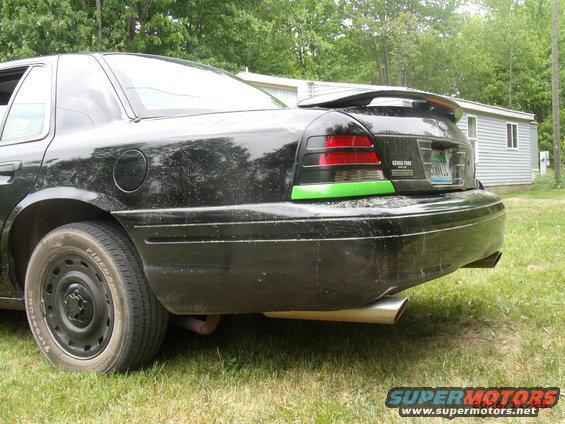 2003 Ford Crown Victoria rear quarter panel with spoiler and aftermarket exhaust