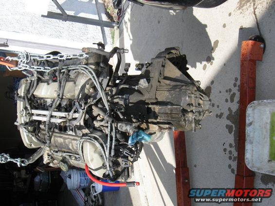Engine and transmission assembly suspended by chains