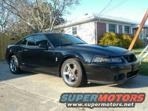 Black Ford Mustang parked on driveway