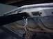 1991 Ford Crown Victoria - Underside of a car hood is visible, supported by an engine hoist and chains.
