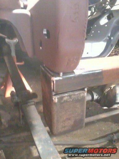 Vehicle frame section with suspension parts, possibly under repair