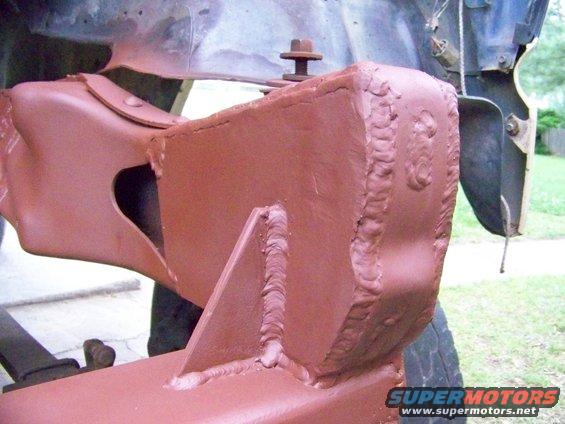 Welded frame modification with visible bolt and bracket