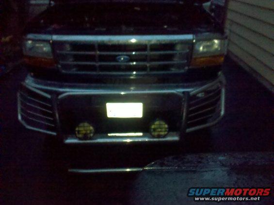 Front of a 1992 Ford F-Series truck with a chrome grille and bumper guard