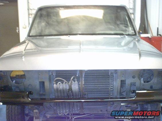1987 Ford F-150 front end with grille removed, showing radiator and AC condenser