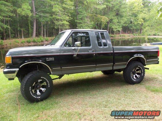 Side view of a 1989 Ford F-150 pickup truck with a two-tone paint job