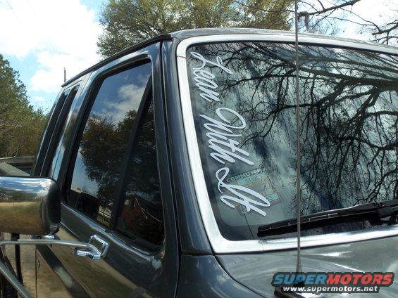 Gray 1989 Ford F-150 passenger side door and windshield with 'Lean With It' decal