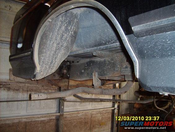 1989 Ford F-150 rear wheel well, frame, and exhaust pipe visible