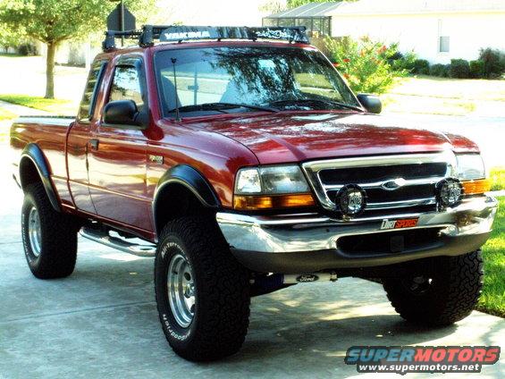 1999 Ford Ranger pickup truck with Yakima roof rack, aftermarket lights, and BFGoodrich tires