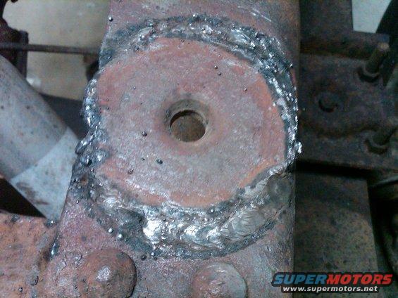 Close-up of a rusty metal part with rough welding