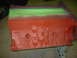 1967 Ford Mustang - Engine block painted orange with masking tape applied to the top edge for painting.