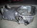 2003 Hyundai Tiburon - This is an oil pan, likely from a vehicle, with a threaded fitting and a sensor attached. The registry information may be incorrect.