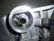 2003 Hyundai Tiburon - This is a close-up view of a vehicle's oil filter housing, showing the threaded nipple where the filter attaches.