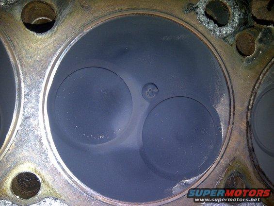Engine cylinder head showing two valves and combustion chambers