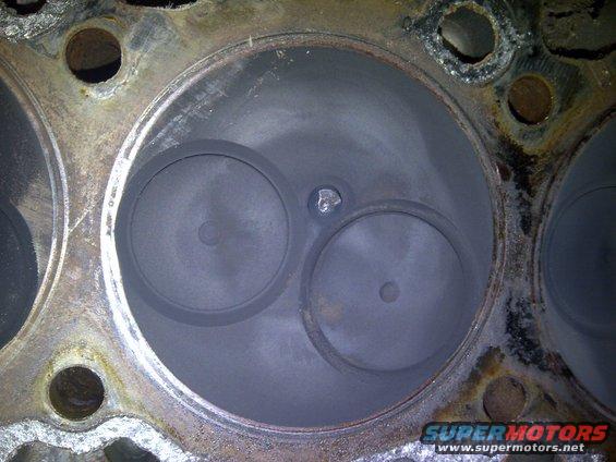 close-up of engine cylinder head with two valves visible