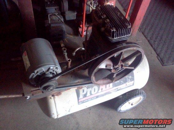 Air compressor with Pro-Air branding and a large pulley