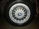 1991 BMW 3 Series - Close-up of a BMW wheel, a multi-spoke design and the iconic BMW emblem.
