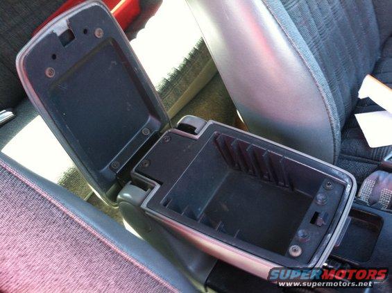 Open center console armrest in a car interior