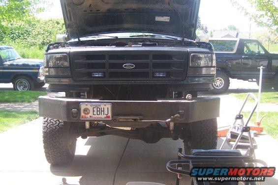 Front view of 1995 Ford Bronco with aftermarket bumper and hood open