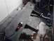 1989 Ford Bronco - A metal plate and a grinder are on a concrete floor, supported by wooden beams in a workshop.