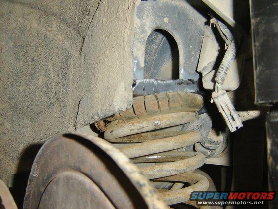 dsc00148.jpg  I can cut the rear spring perch off my old 86 stang and weld those on to Lincoln. after trimming the tabs down on the Lincoln body and installing the spring perch for the stang . I weld them into place.
