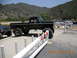 1986 Ford Bronco - A lifted black 1979 Ford F-150 pickup truck is parked next to another off-road vehicle.