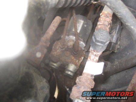 rusted ABS control module with brake lines attached