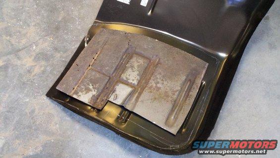 close-up of a rusted metal panel with some stamped indentations
